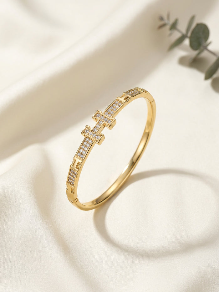 Stone Studded H Gold Bangle Bracelet
