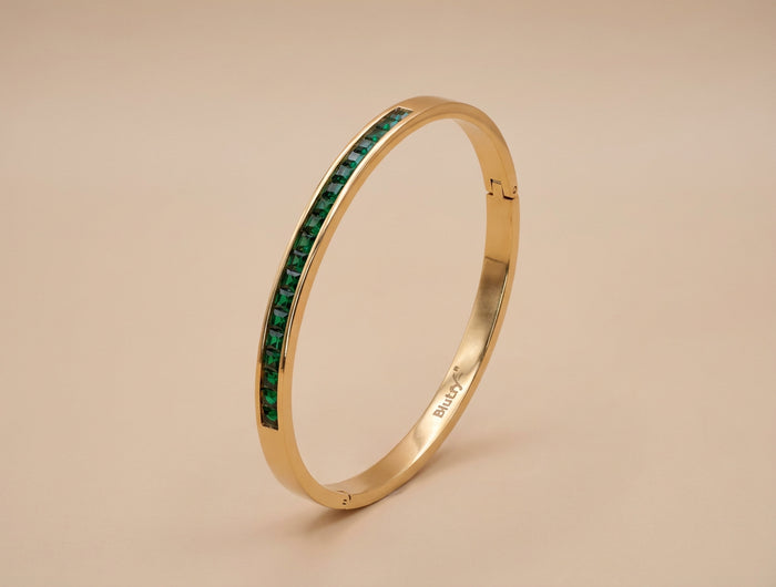 Gold Bangle with Emerald Stone Channel