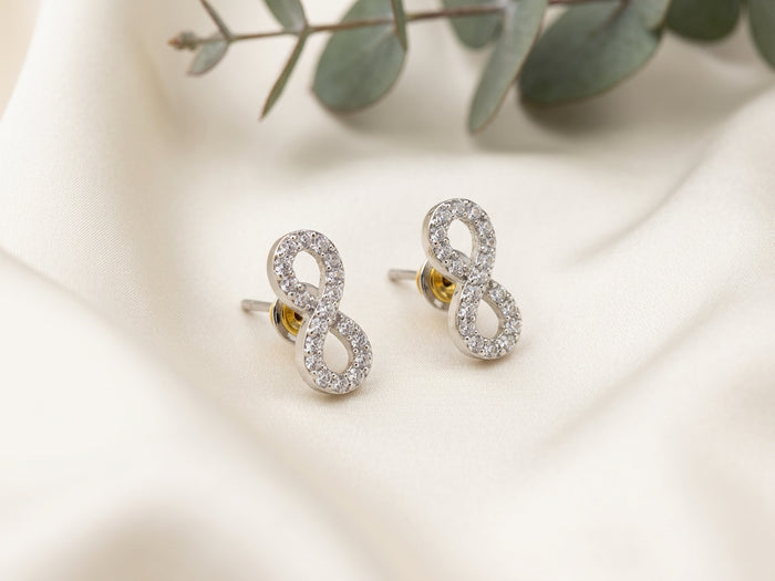 Infinity AD Stone Silver Tone Stud Earrings